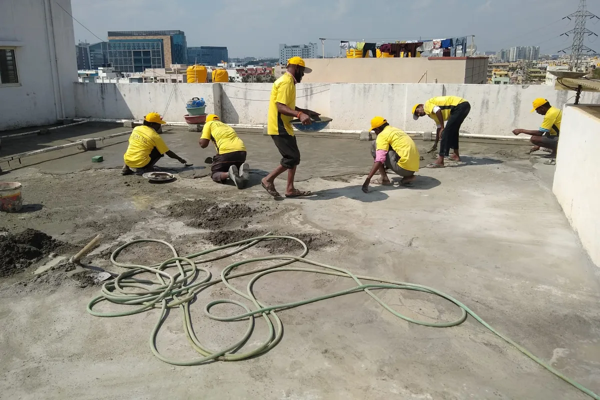 Ultra Max technicians working across a stripped terrace slab
